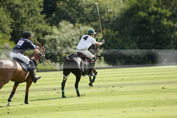 Pandas (white) v Home Farm (navy) in a Park House West Sussex Cup Polo match on Brooksfield at Cowdray Park Polo Club on Friday 30 August 2013. 2013.08.30 www.polopictures.co.uk