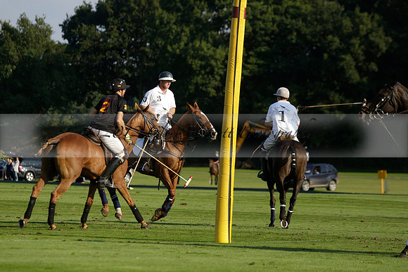 Pluma Negra (white) v Shoreline (black) in the Brecknock Cup Subsidiary final polo match played on Sunday 25 August 2013 at Cowdray Park Polo Club on Ambersham 1. 2013.10.12 www.polopictures.co.uk