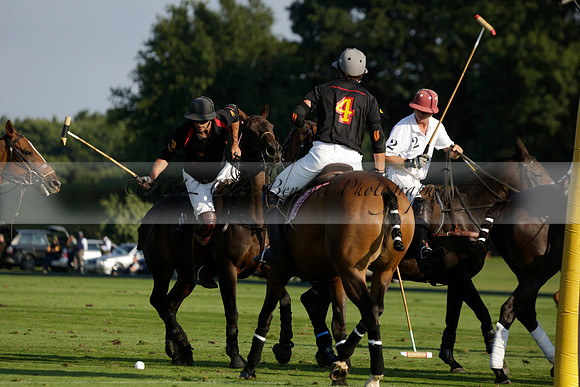 Pluma Negra (white) v Shoreline (black) in the Brecknock Cup Subsidiary final polo match played on Sunday 25 August 2013 at Cowdray Park Polo Club on Ambersham 1. 2013.10.12 www.polopictures.co.uk