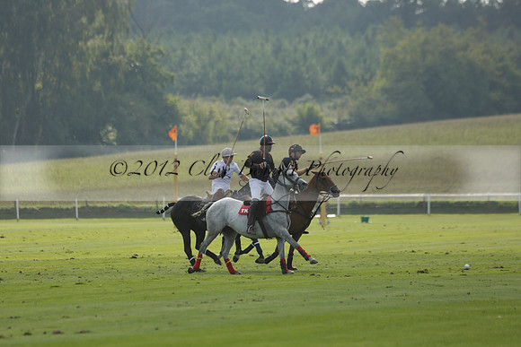 Pluma Negra (white) v Shoreline (black) in the Brecknock Cup Subsidiary final polo match played on Sunday 25 August 2013 at Cowdray Park Polo Club on Ambersham 1. 2013.10.12 www.polopictures.co.uk