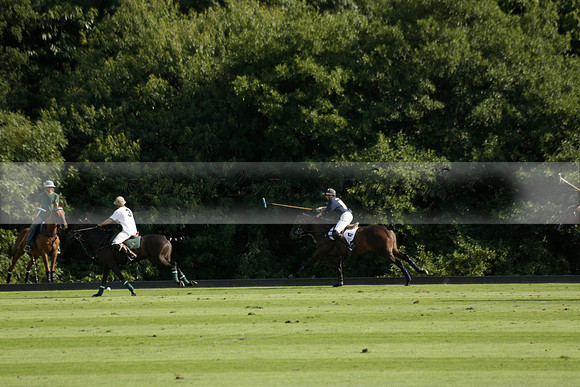 Pandas (white) v Home Farm (navy) in a Park House West Sussex Cup Polo match on Brooksfield at Cowdray Park Polo Club on Friday 30 August 2013. 2013.08.30 www.polopictures.co.uk