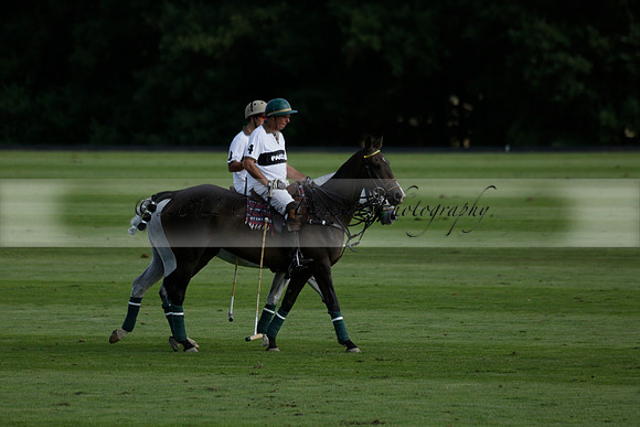 Pandas (white) v Home Farm (navy) in a Park House West Sussex Cup Polo match on Brooksfield at Cowdray Park Polo Club on Friday 30 August 2013. 2013.08.30 www.polopictures.co.uk