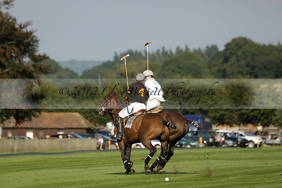 Pluma Negra (white) v Shoreline (black) in the Brecknock Cup Subsidiary final polo match played on Sunday 25 August 2013 at Cowdray Park Polo Club on Ambersham 1. 2013.10.12 www.polopictures.co.uk
