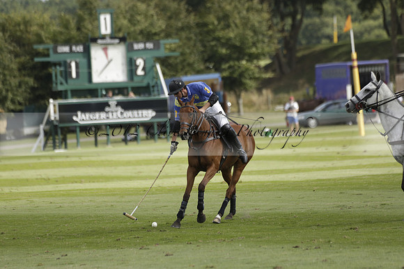 Combe Place (blue) v Silver Fox (white) in a Park House West Sussex Cup Polo match on Ambersham 1 at Cowdray Park Polo Club on Friday 30 August 2013. 2013.08.30 www.polopictures.co.uk