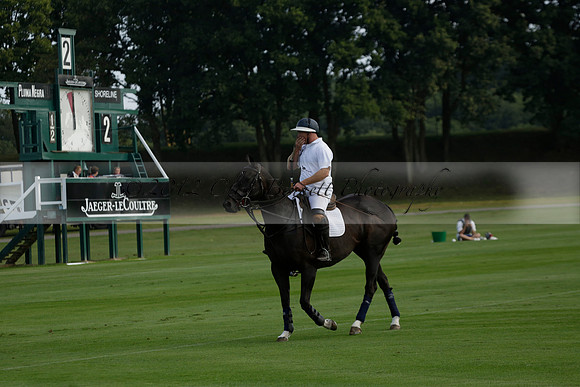 Pluma Negra (white) v Shoreline (black) in the Brecknock Cup Subsidiary final polo match played on Sunday 25 August 2013 at Cowdray Park Polo Club on Ambersham 1. 2013.10.12 www.polopictures.co.uk