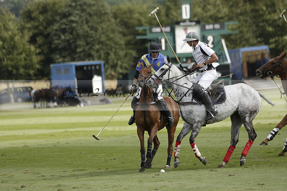 Combe Place (blue) v Silver Fox (white) in a Park House West Sussex Cup Polo match on Ambersham 1 at Cowdray Park Polo Club on Friday 30 August 2013. 2013.08.30 www.polopictures.co.uk
