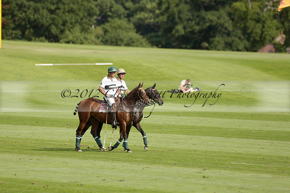 Pandas (white) v Home Farm (navy) in a Park House West Sussex Cup Polo match on Brooksfield at Cowdray Park Polo Club on Friday 30 August 2013. 2013.08.30 www.polopictures.co.uk