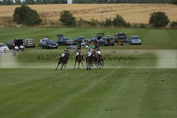 Jaeger Le Coultre (black)  v Wairakei Pastoral (white) in a Jaeger Le Coultre Holden White Cup polo match played on 29 July 2013 at Cowdray Park Polo Club on Brooksfieldwww.polopictures.co.uk