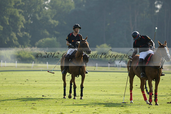 Pluma Negra (white) v Shoreline (black) in the Brecknock Cup Subsidiary final polo match played on Sunday 25 August 2013 at Cowdray Park Polo Club on Ambersham 1. 2013.10.12 www.polopictures.co.uk