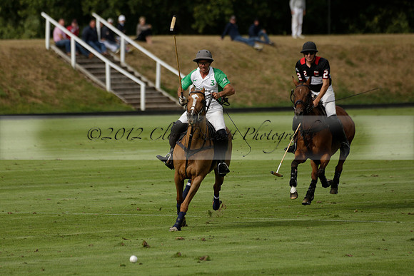 Jaeger Le Coultre (black)  v Wairakei Pastoral (white) in a Jaeger Le Coultre Holden White Cup polo match played on 29 July 2013 at Cowdray Park Polo Club on Brooksfieldwww.polopictures.co.uk