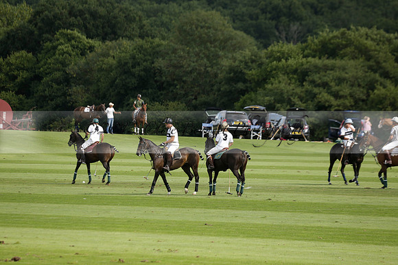 Pandas (white) v Home Farm (navy) in a Park House West Sussex Cup Polo match on Brooksfield at Cowdray Park Polo Club on Friday 30 August 2013. 2013.08.30 www.polopictures.co.uk