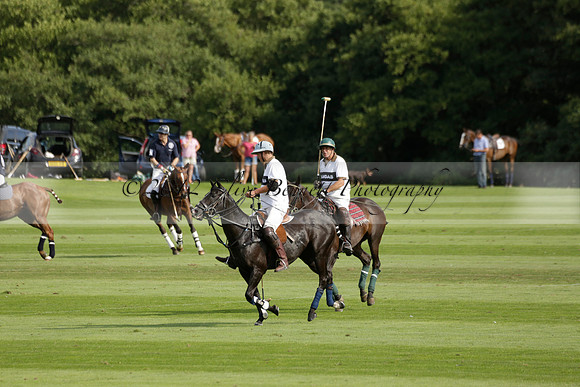 Pandas (white) v Home Farm (navy) in a Park House West Sussex Cup Polo match on Brooksfield at Cowdray Park Polo Club on Friday 30 August 2013. 2013.08.30 www.polopictures.co.uk