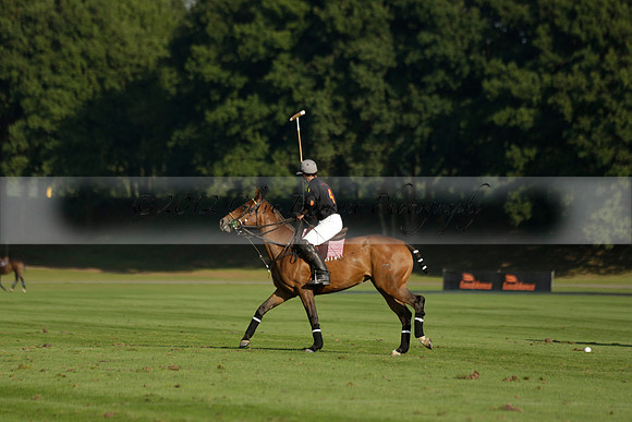 Pluma Negra (white) v Shoreline (black) in the Brecknock Cup Subsidiary final polo match played on Sunday 25 August 2013 at Cowdray Park Polo Club on Ambersham 1. 2013.10.12 www.polopictures.co.uk