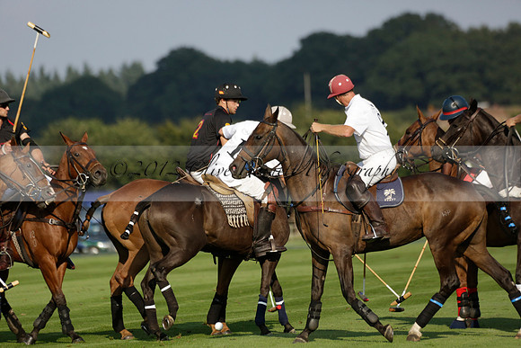 Pluma Negra (white) v Shoreline (black) in the Brecknock Cup Subsidiary final polo match played on Sunday 25 August 2013 at Cowdray Park Polo Club on Ambersham 1. 2013.10.12 www.polopictures.co.uk