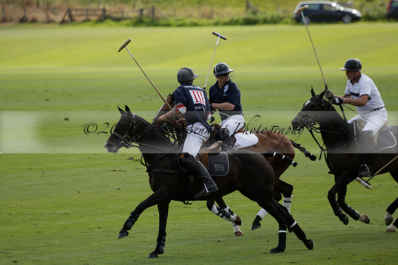 Pandas (white) v Home Farm (navy) in a Park House West Sussex Cup Polo match on Brooksfield at Cowdray Park Polo Club on Friday 30 August 2013. 2013.08.30 www.polopictures.co.uk