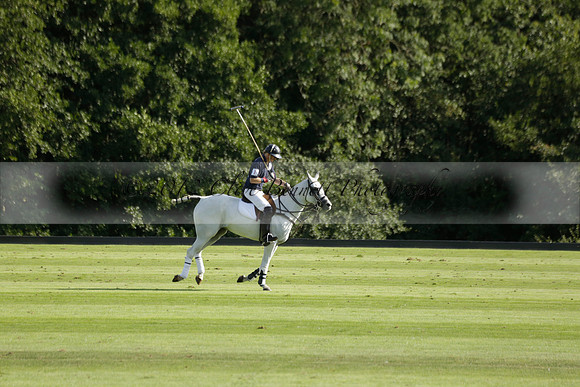 Pandas (white) v Home Farm (navy) in a Park House West Sussex Cup Polo match on Brooksfield at Cowdray Park Polo Club on Friday 30 August 2013. 2013.08.30 www.polopictures.co.uk
