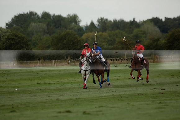 Ghost Chilli (blue) v Team Tonic (red) in a Lodsworth Cup Polo match on Ambersham 3 at Cowdray Park Polo Club on Friday 30 August 2013. 2013.08.30 www.polopictures.co.uk