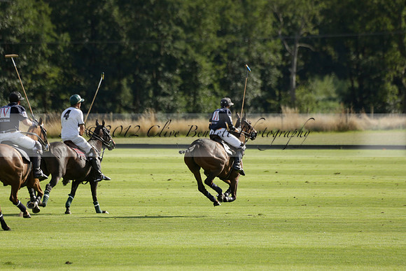 Pandas (white) v Home Farm (navy) in a Park House West Sussex Cup Polo match on Brooksfield at Cowdray Park Polo Club on Friday 30 August 2013. 2013.08.30 www.polopictures.co.uk