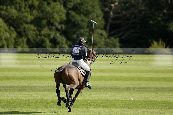 Pandas (white) v Home Farm (navy) in a Park House West Sussex Cup Polo match on Brooksfield at Cowdray Park Polo Club on Friday 30 August 2013. 2013.08.30 www.polopictures.co.uk