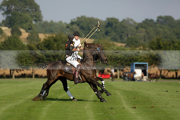 Pluma Negra (white) v Shoreline (black) in the Brecknock Cup Subsidiary final polo match played on Sunday 25 August 2013 at Cowdray Park Polo Club on Ambersham 1. 2013.10.12 www.polopictures.co.uk