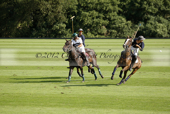Pandas (white) v Home Farm (navy) in a Park House West Sussex Cup Polo match on Brooksfield at Cowdray Park Polo Club on Friday 30 August 2013. 2013.08.30 www.polopictures.co.uk