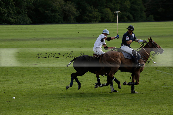 Pandas (white) v Home Farm (navy) in a Park House West Sussex Cup Polo match on Brooksfield at Cowdray Park Polo Club on Friday 30 August 2013. 2013.08.30 www.polopictures.co.uk