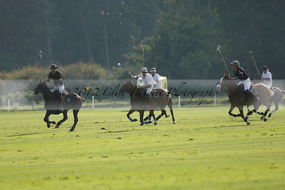 Pluma Negra (white) v Shoreline (black) in the Brecknock Cup Subsidiary final polo match played on Sunday 25 August 2013 at Cowdray Park Polo Club on Ambersham 1. 2013.10.12 www.polopictures.co.uk