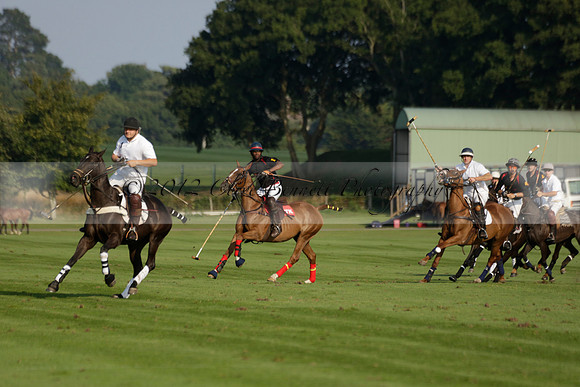 Pluma Negra (white) v Shoreline (black) in the Brecknock Cup Subsidiary final polo match played on Sunday 25 August 2013 at Cowdray Park Polo Club on Ambersham 1. 2013.10.12 www.polopictures.co.uk
