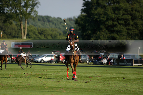 Pluma Negra (white) v Shoreline (black) in the Brecknock Cup Subsidiary final polo match played on Sunday 25 August 2013 at Cowdray Park Polo Club on Ambersham 1. 2013.10.12 www.polopictures.co.uk