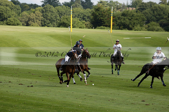 Pandas (white) v Home Farm (navy) in a Park House West Sussex Cup Polo match on Brooksfield at Cowdray Park Polo Club on Friday 30 August 2013. 2013.08.30 www.polopictures.co.uk