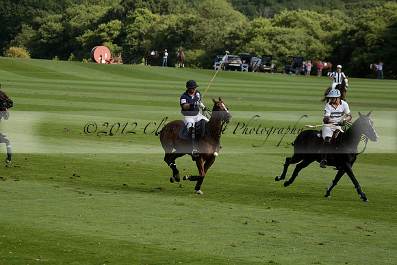 Pandas (white) v Home Farm (navy) in a Park House West Sussex Cup Polo match on Brooksfield at Cowdray Park Polo Club on Friday 30 August 2013. 2013.08.30 www.polopictures.co.uk