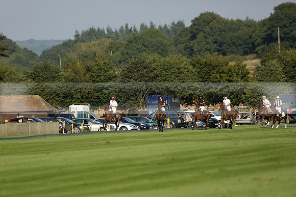 Pluma Negra (white) v Shoreline (black) in the Brecknock Cup Subsidiary final polo match played on Sunday 25 August 2013 at Cowdray Park Polo Club on Ambersham 1. 2013.10.12 www.polopictures.co.uk