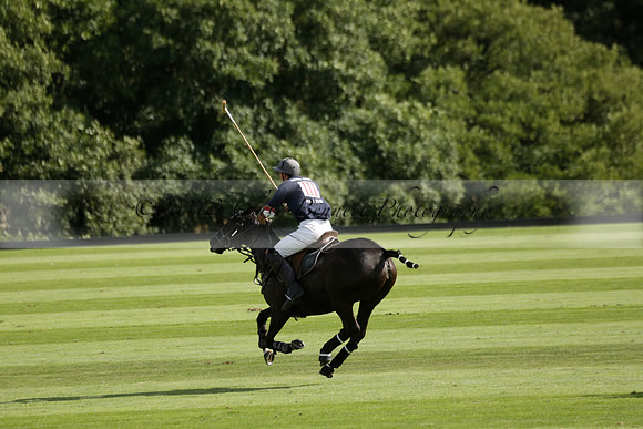 Pandas (white) v Home Farm (navy) in a Park House West Sussex Cup Polo match on Brooksfield at Cowdray Park Polo Club on Friday 30 August 2013. 2013.08.30 www.polopictures.co.uk