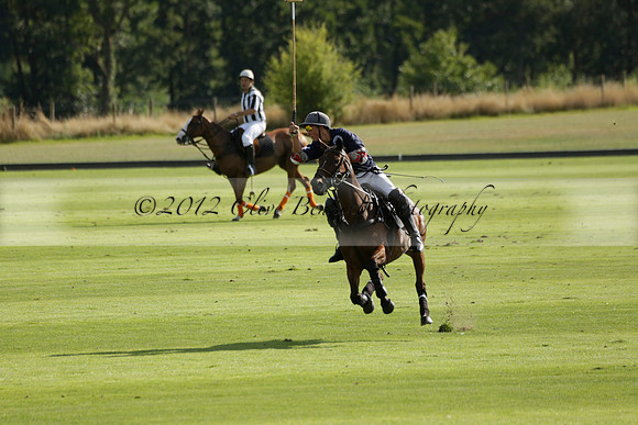 Pandas (white) v Home Farm (navy) in a Park House West Sussex Cup Polo match on Brooksfield at Cowdray Park Polo Club on Friday 30 August 2013. 2013.08.30 www.polopictures.co.uk