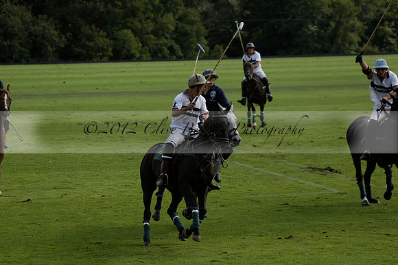 Pandas (white) v Home Farm (navy) in a Park House West Sussex Cup Polo match on Brooksfield at Cowdray Park Polo Club on Friday 30 August 2013. 2013.08.30 www.polopictures.co.uk