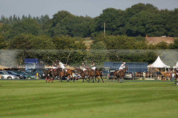 Pluma Negra (white) v Shoreline (black) in the Brecknock Cup Subsidiary final polo match played on Sunday 25 August 2013 at Cowdray Park Polo Club on Ambersham 1. 2013.10.12 www.polopictures.co.uk