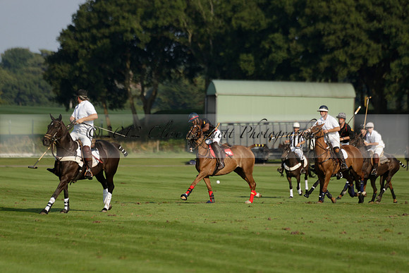 Pluma Negra (white) v Shoreline (black) in the Brecknock Cup Subsidiary final polo match played on Sunday 25 August 2013 at Cowdray Park Polo Club on Ambersham 1. 2013.10.12 www.polopictures.co.uk