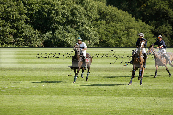 Pandas (white) v Home Farm (navy) in a Park House West Sussex Cup Polo match on Brooksfield at Cowdray Park Polo Club on Friday 30 August 2013. 2013.08.30 www.polopictures.co.uk