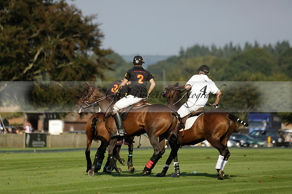 Pluma Negra (white) v Shoreline (black) in the Brecknock Cup Subsidiary final polo match played on Sunday 25 August 2013 at Cowdray Park Polo Club on Ambersham 1. 2013.10.12 www.polopictures.co.uk