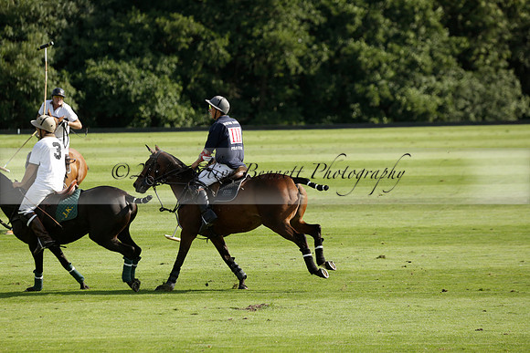 Pandas (white) v Home Farm (navy) in a Park House West Sussex Cup Polo match on Brooksfield at Cowdray Park Polo Club on Friday 30 August 2013. 2013.08.30 www.polopictures.co.uk