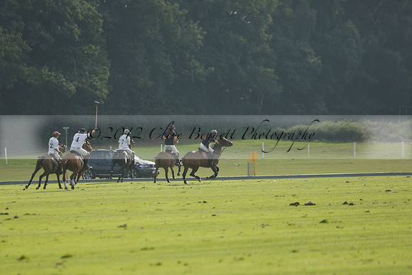 Pluma Negra (white) v Shoreline (black) in the Brecknock Cup Subsidiary final polo match played on Sunday 25 August 2013 at Cowdray Park Polo Club on Ambersham 1. 2013.10.12 www.polopictures.co.uk
