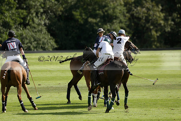 Pandas (white) v Home Farm (navy) in a Park House West Sussex Cup Polo match on Brooksfield at Cowdray Park Polo Club on Friday 30 August 2013. 2013.08.30 www.polopictures.co.uk