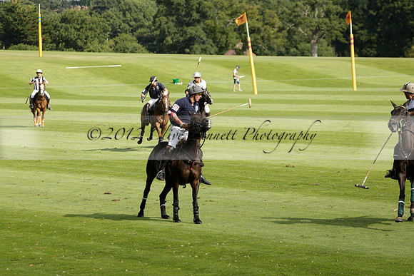 Pandas (white) v Home Farm (navy) in a Park House West Sussex Cup Polo match on Brooksfield at Cowdray Park Polo Club on Friday 30 August 2013. 2013.08.30 www.polopictures.co.uk