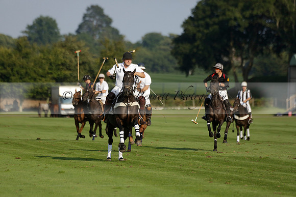 Pluma Negra (white) v Shoreline (black) in the Brecknock Cup Subsidiary final polo match played on Sunday 25 August 2013 at Cowdray Park Polo Club on Ambersham 1. 2013.10.12 www.polopictures.co.uk