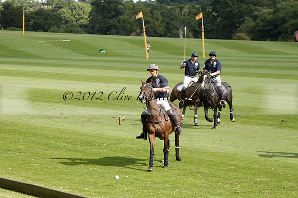 Pandas (white) v Home Farm (navy) in a Park House West Sussex Cup Polo match on Brooksfield at Cowdray Park Polo Club on Friday 30 August 2013. 2013.08.30 www.polopictures.co.uk