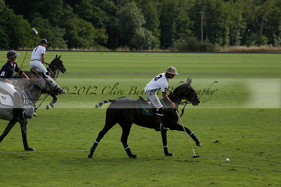 Pandas (white) v Home Farm (navy) in a Park House West Sussex Cup Polo match on Brooksfield at Cowdray Park Polo Club on Friday 30 August 2013. 2013.08.30 www.polopictures.co.uk