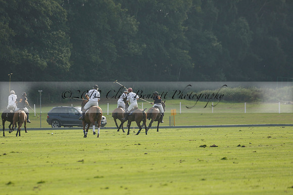Pluma Negra (white) v Shoreline (black) in the Brecknock Cup Subsidiary final polo match played on Sunday 25 August 2013 at Cowdray Park Polo Club on Ambersham 1. 2013.10.12 www.polopictures.co.uk