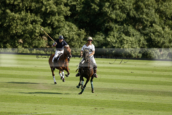 Pandas (white) v Home Farm (navy) in a Park House West Sussex Cup Polo match on Brooksfield at Cowdray Park Polo Club on Friday 30 August 2013. 2013.08.30 www.polopictures.co.uk