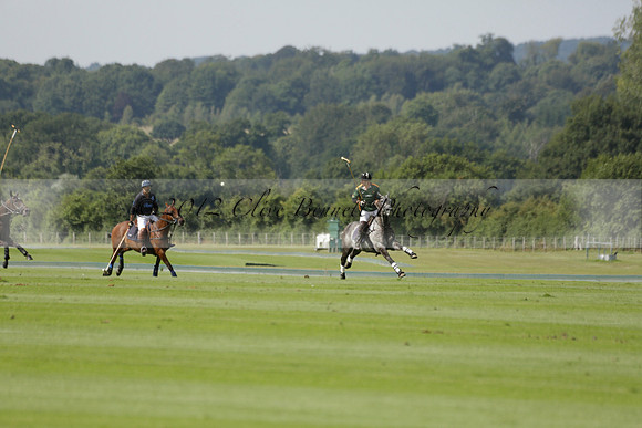 Maiz Dulce (green) v River (blue) in a Uber Polo Midsummer 12 goal polo match on Wednesday 21 August 2013 at Cowdray park Polo Club on Ambersham 2.  www.polopictures.co.uk