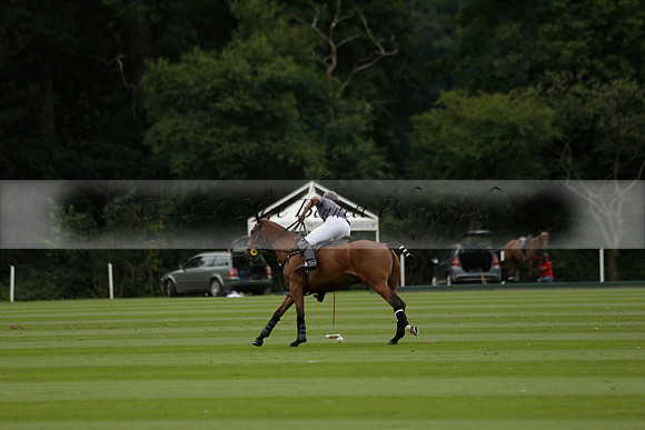 La Tremenda (lilac) v Maiz Dulce (yellow) in a Brecknock Cup polo match played on Lawns 1 at the Cowdray Park Polo Club on Tuesday 13 August 2013